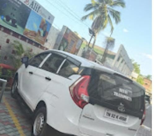 Bevin Transports branded taxi vehicle rear view