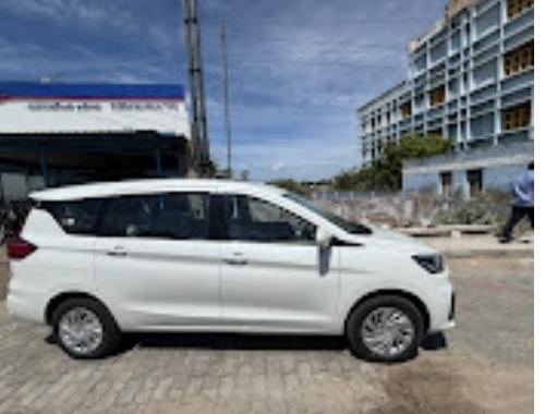 Bevin Transports Ertiga taxi parked in Tiruchendur